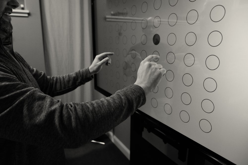 A patient training on the Senaptec Sensory Station at CoreNeuro